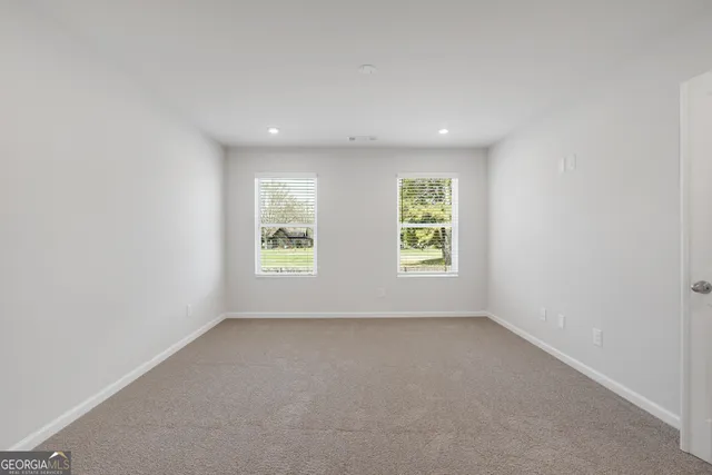 an empty room with windows