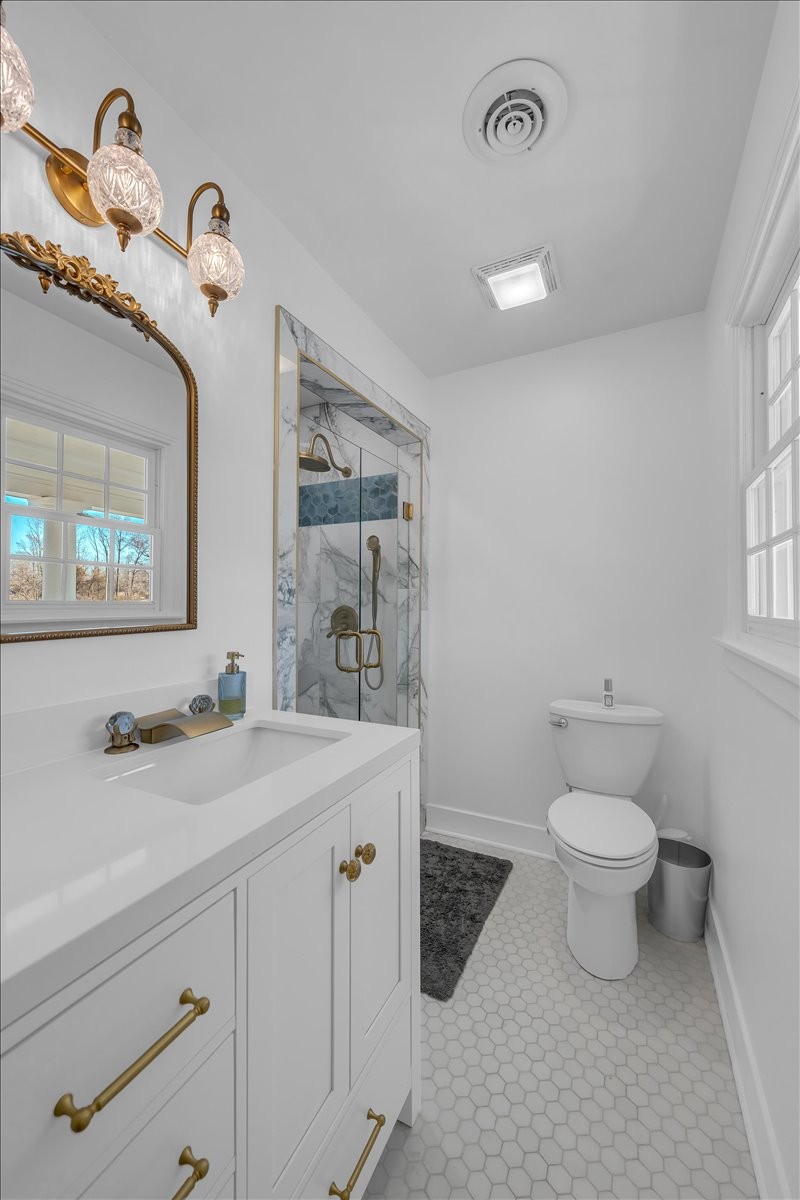 251 Miller Road Hillsboro, TN 37342 - Photo 45 of 80 a bathroom with a sink a toilet and a mirror