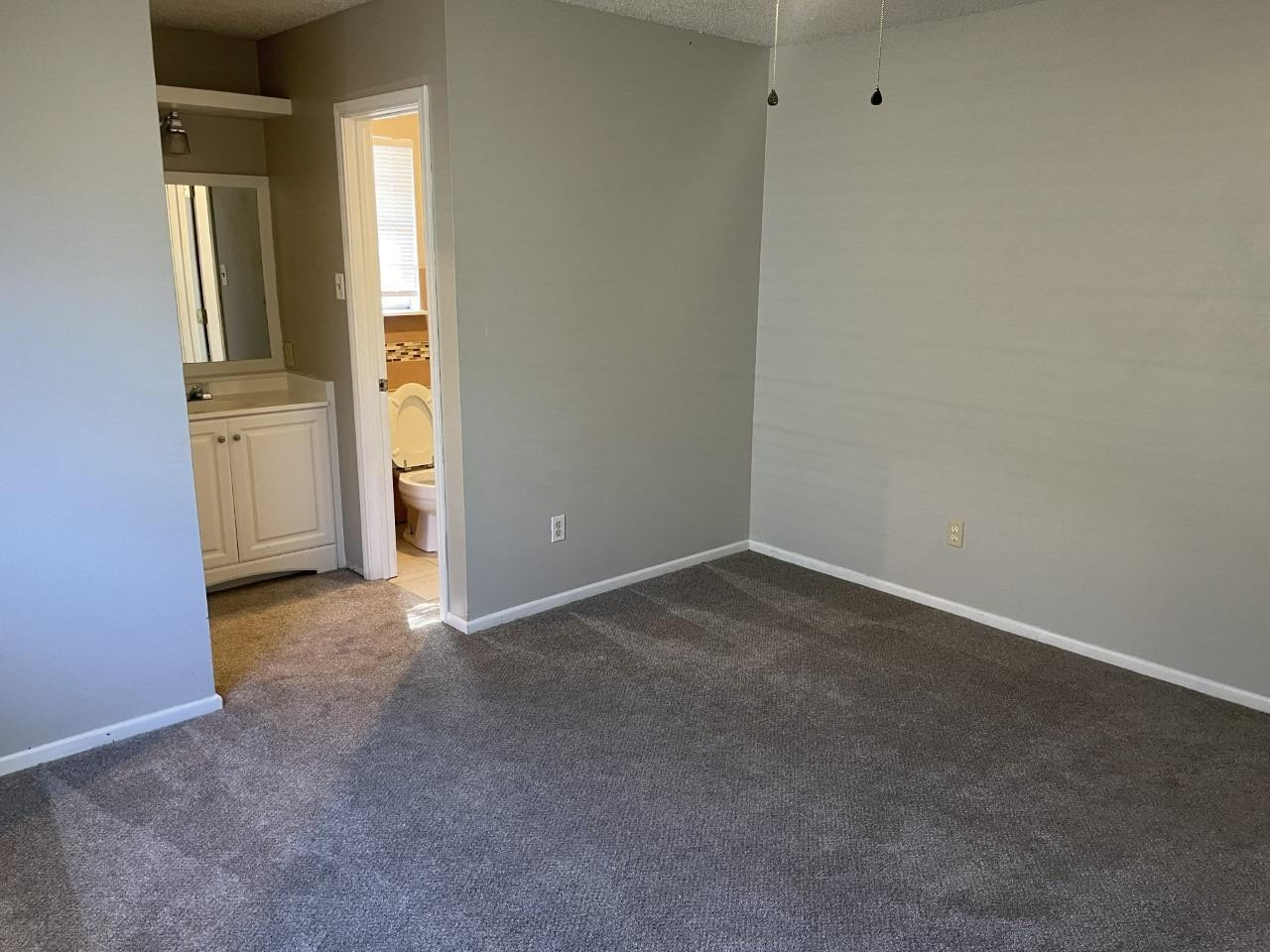 4832 9th Street Lubbock, TX 79416 - Photo 4 of 10 an empty room with a bathroom