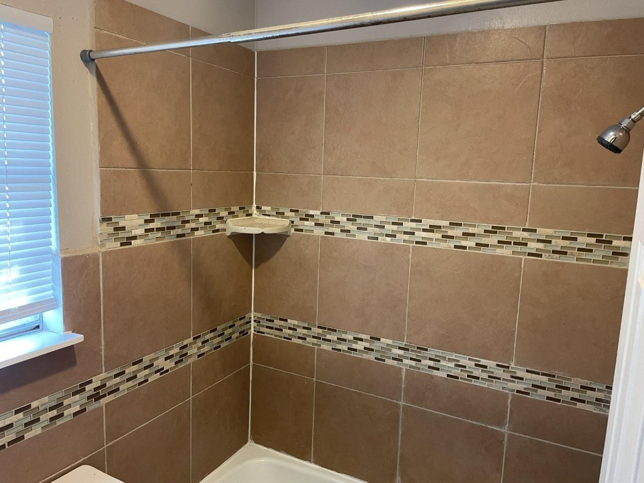 4832 9th Street Lubbock, TX 79416 - Photo 5 of 10 a bathroom with a shower