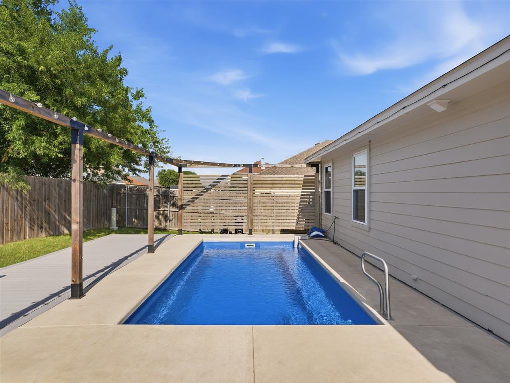 12724 Carpenter Lane Rhome, TX 76078 - Photo 24 of 37 Elongated inground pool with concrete surround