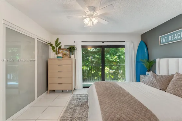 a bed room with a bed and a window