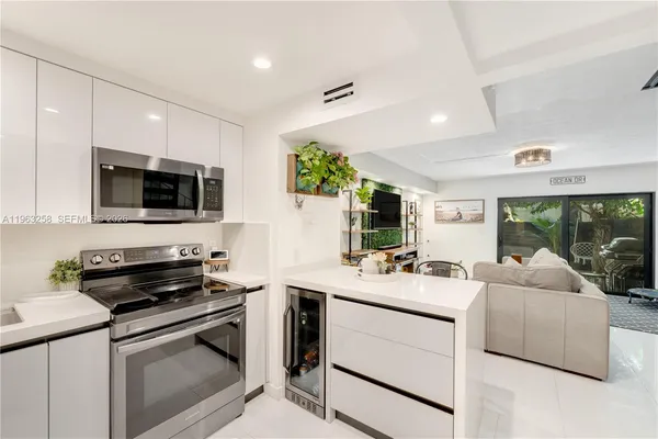 a kitchen with a sink stove and microwave