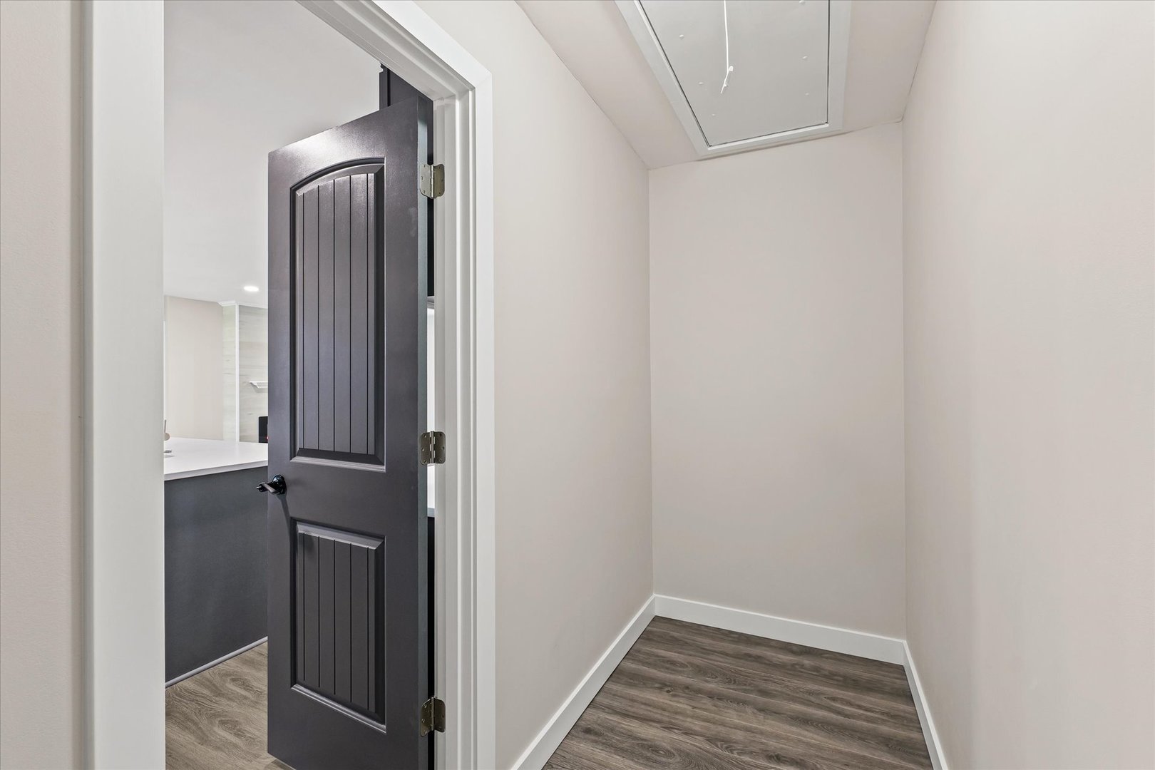 402 Beeson Road Urbana, IL 61802 - Photo 13 of 33 a view of a hallway with closet and wooden floor