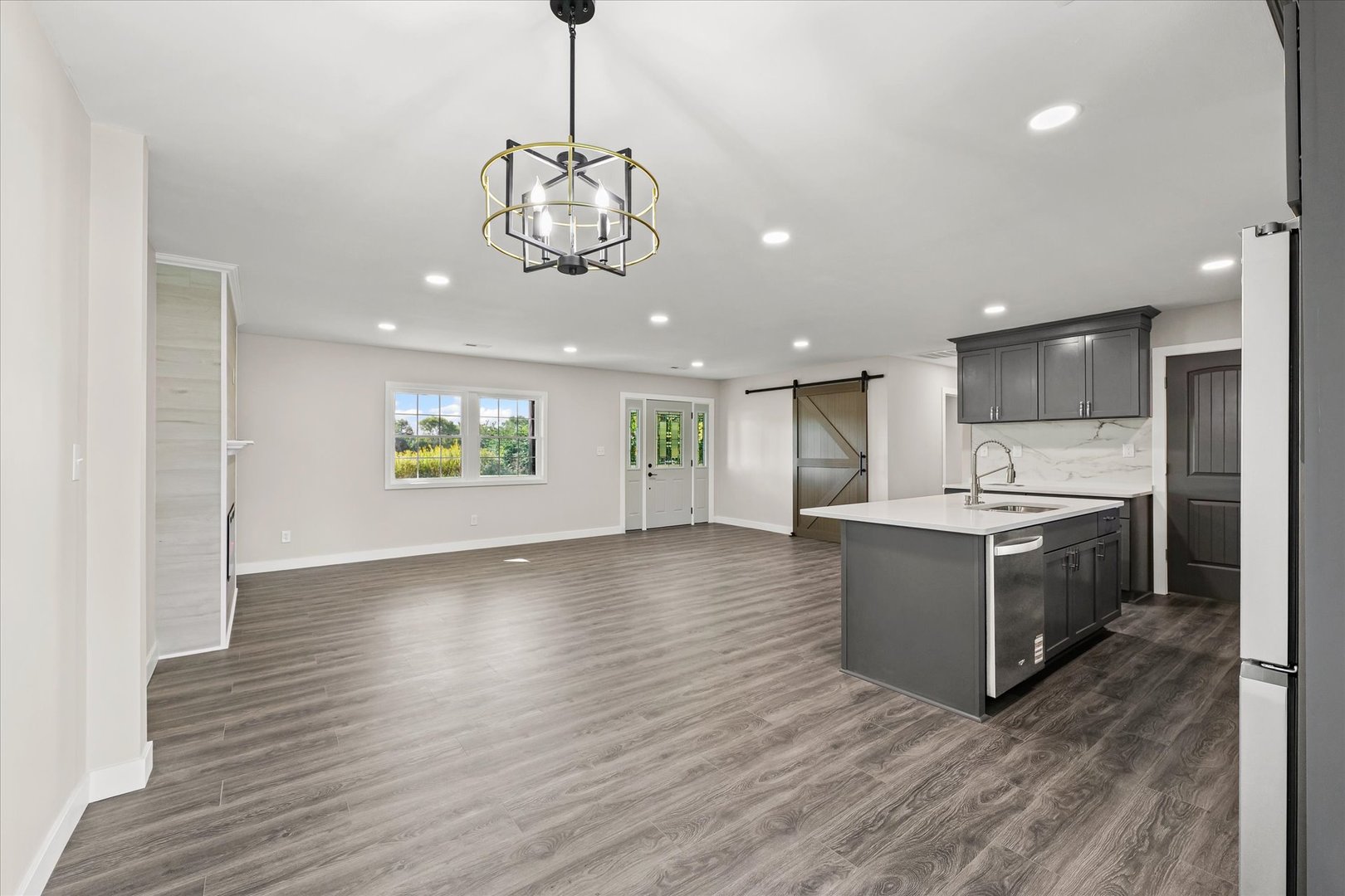 402 Beeson Road Urbana, IL 61802 - Photo 15 of 33 a view of an empty room and kitchen with wooden floor