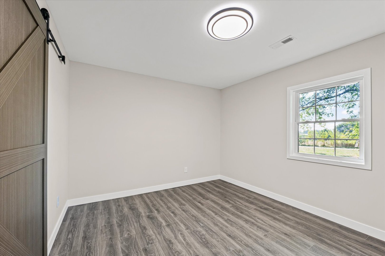402 Beeson Road Urbana, IL 61802 - Photo 16 of 33 a view of room with window and wooden floor