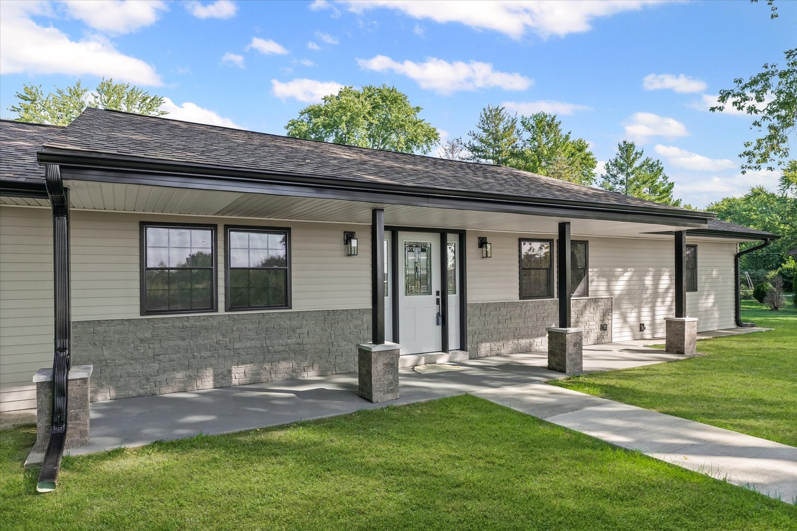 402 Beeson Road Urbana, IL 61802 - Photo 3 of 33 a front view of a house with a yard