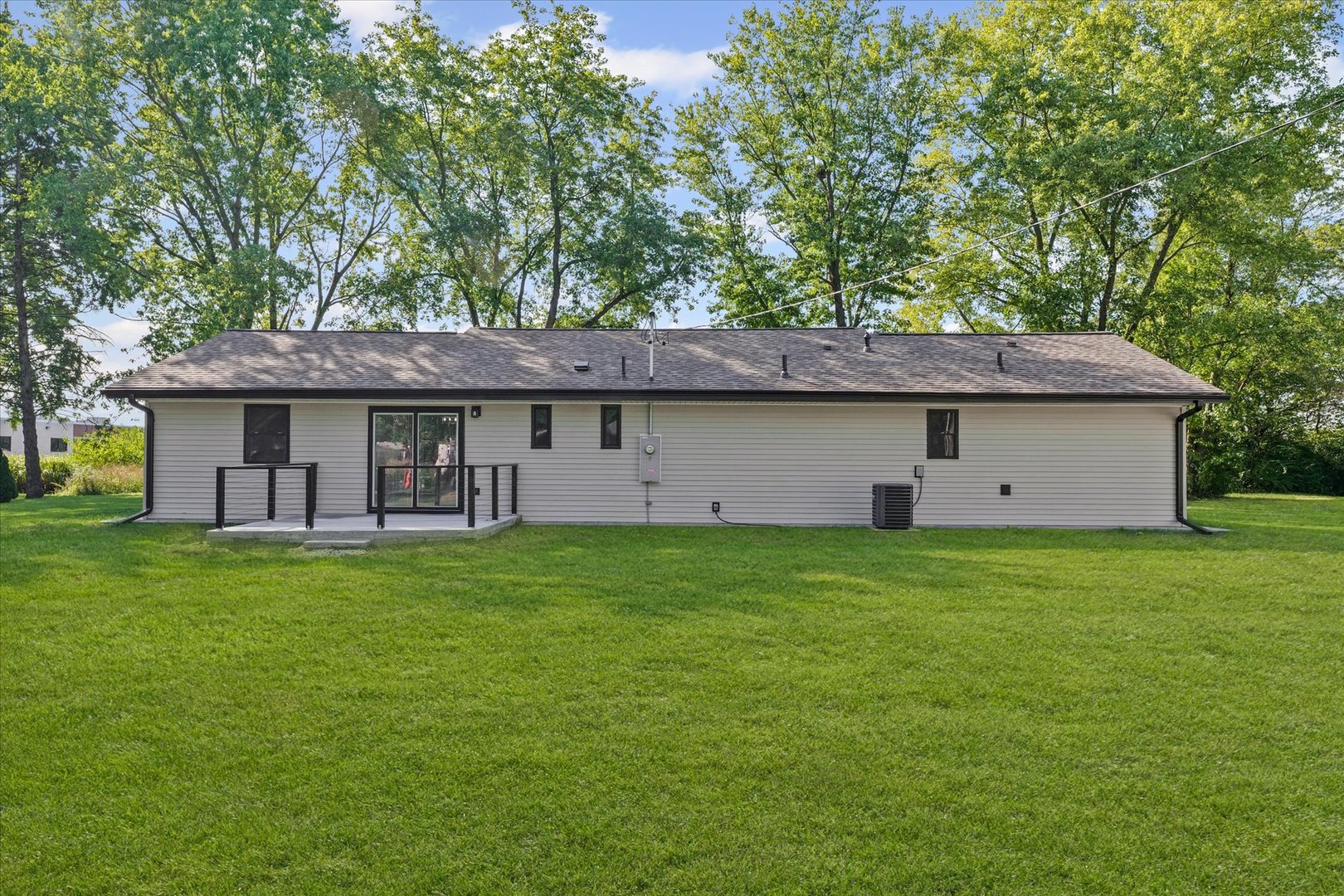 402 Beeson Road Urbana, IL 61802 - Photo 32 of 33 a view of a house with a backyard