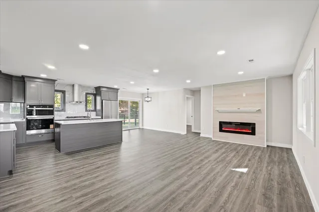 a view of kitchen with cabinets and wooden floor