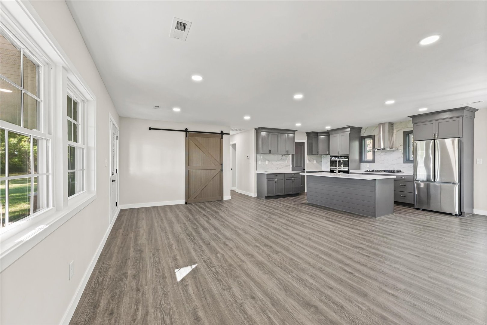402 Beeson Road Urbana, IL 61802 - Photo 8 of 33 a view of kitchen with wooden floor and windows