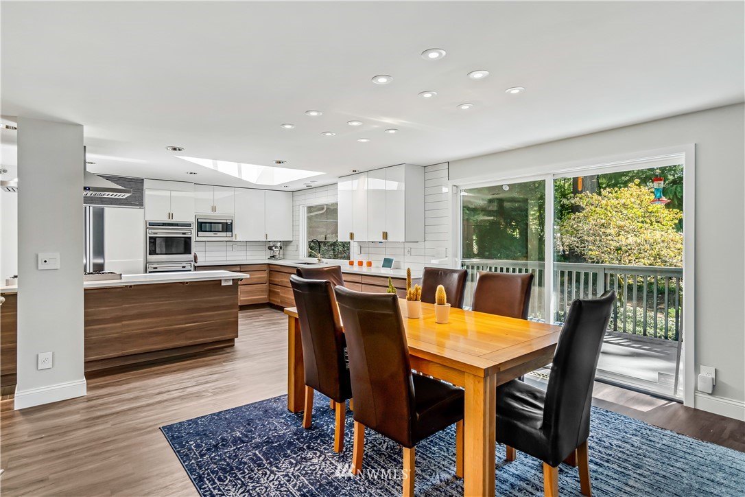 12833 Southeast 45th Place Bellevue, WA 98006 - Photo 13 of 40 a view of a dining room with furniture and wooden floor