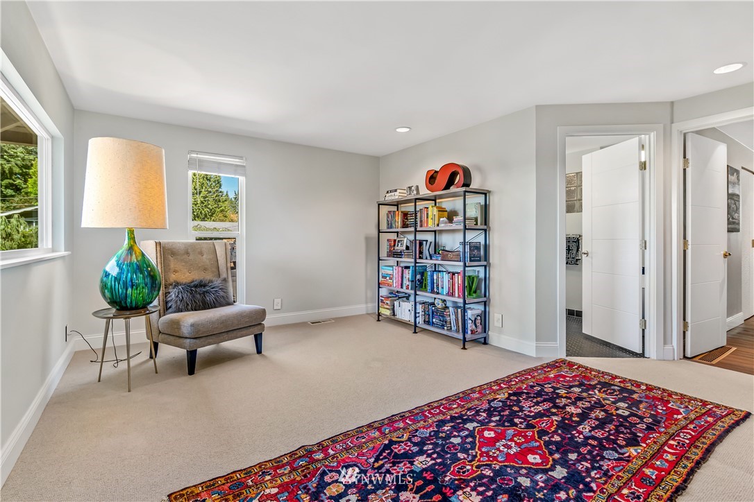 12833 Southeast 45th Place Bellevue, WA 98006 - Photo 15 of 40 a bedroom with furniture and a book shelf