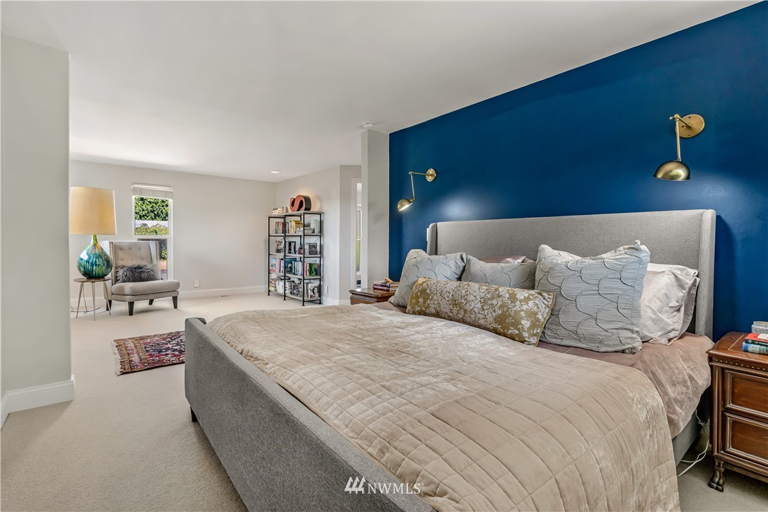 12833 Southeast 45th Place Bellevue, WA 98006 - Photo 16 of 40 a bedroom with a bed a couch and a window