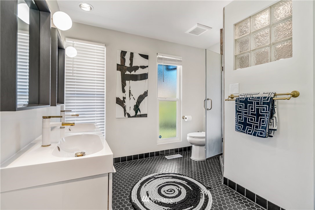 12833 Southeast 45th Place Bellevue, WA 98006 - Photo 18 of 40 a bathroom with a sink and a mirror