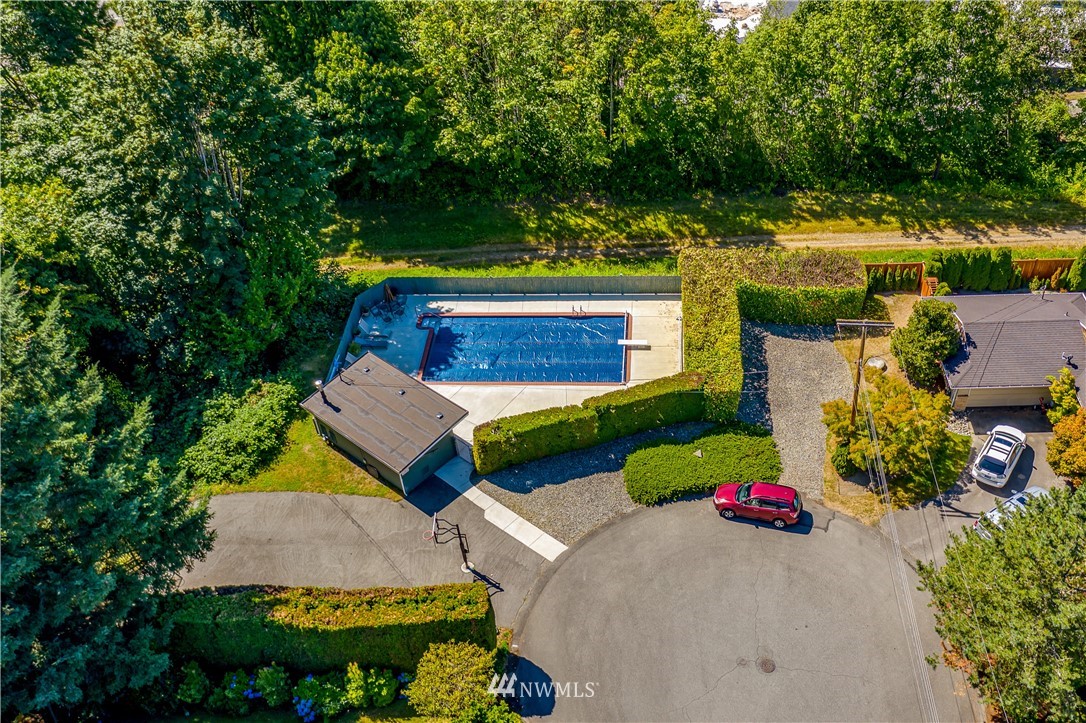 12833 Southeast 45th Place Bellevue, WA 98006 - Photo 3 of 40 a view of yard with swimming pool and outdoor seating