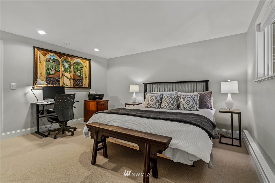 12833 Southeast 45th Place Bellevue, WA 98006 - Photo 28 of 40 a bedroom with a bed a desk and chair