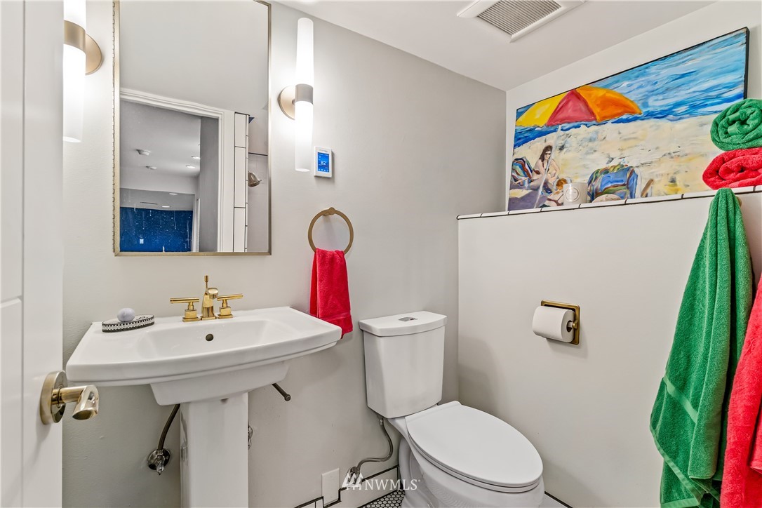 12833 Southeast 45th Place Bellevue, WA 98006 - Photo 30 of 40 a bathroom with a sink mirror vanity and toilet