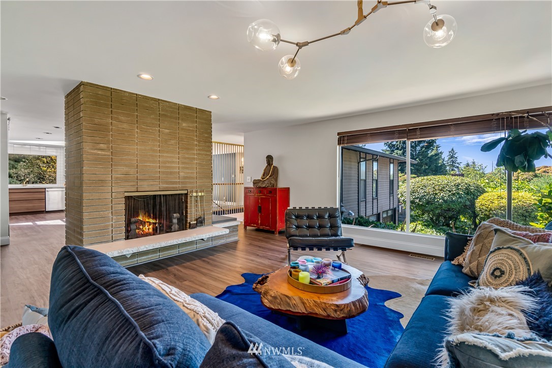 12833 Southeast 45th Place Bellevue, WA 98006 - Photo 6 of 40 a living room with furniture and a fireplace