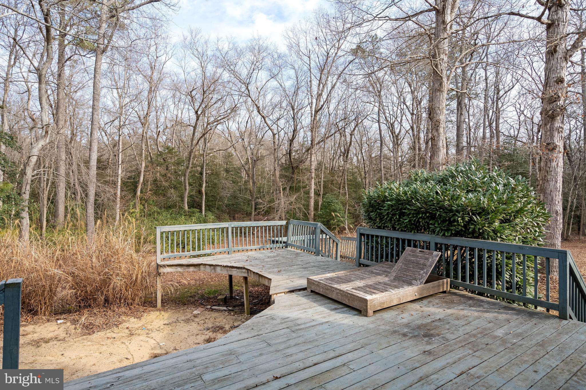 18885 Sand Hill Road Milton, DE 19968 - Photo 39 of 46 a view of deck with furniture and trees