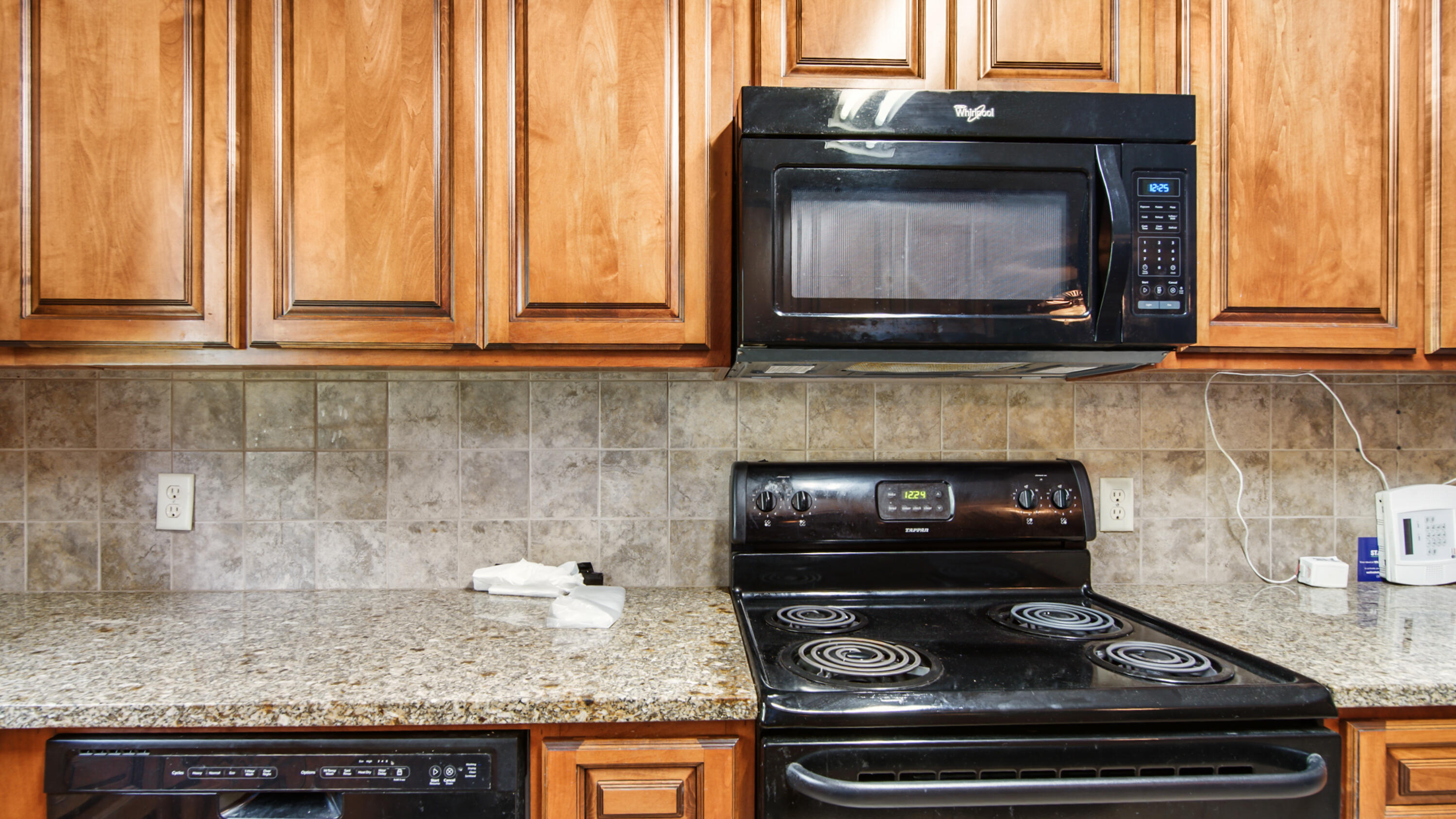 2374 Co Highway 280A DeFuniak Springs, FL 32435 - Photo 20 of 66 a kitchen with granite countertop a stove and a microwave