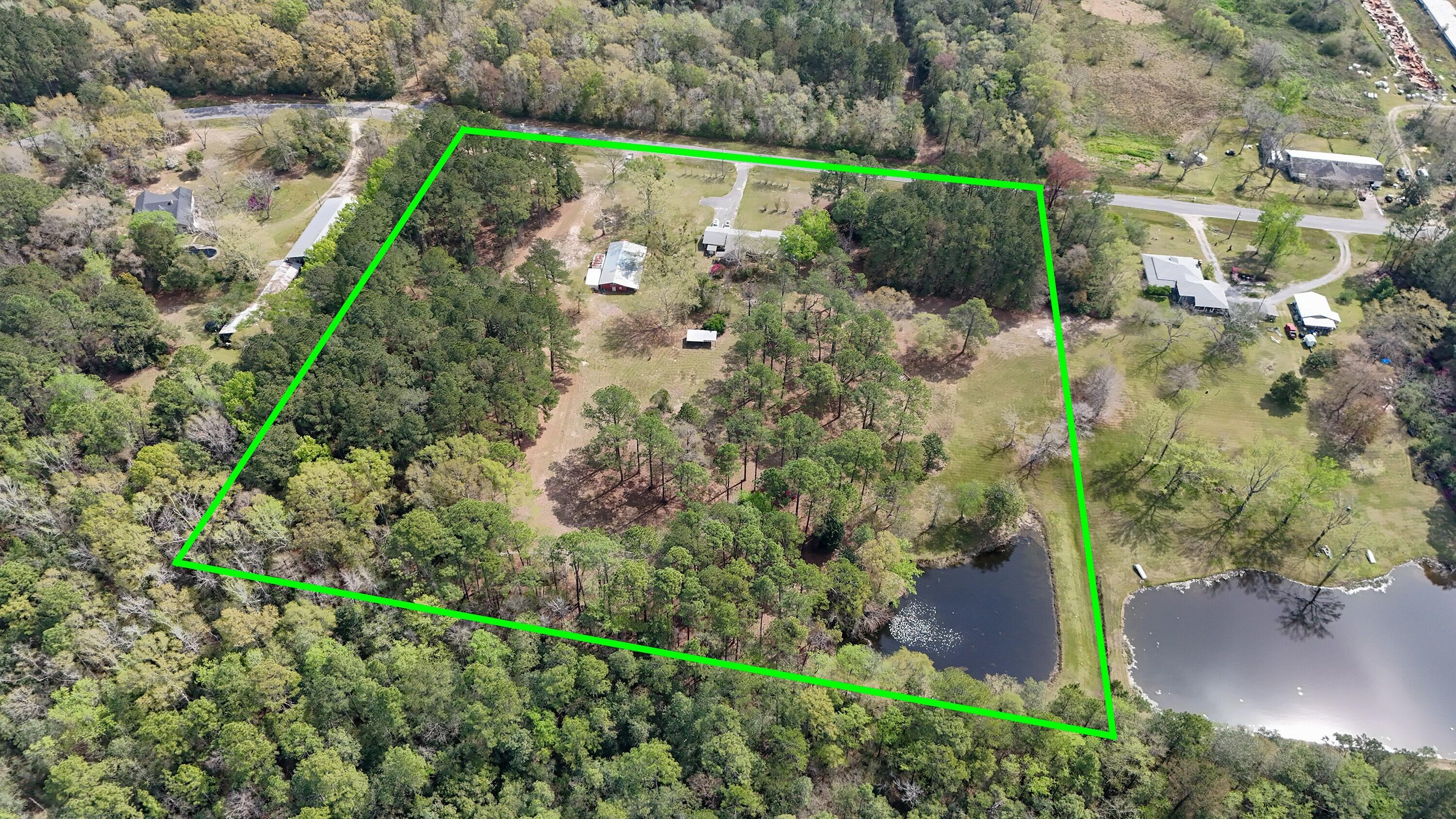 2374 Co Highway 280A DeFuniak Springs, FL 32435 - Photo 3 of 66 an aerial view of a house with a yard and lake view