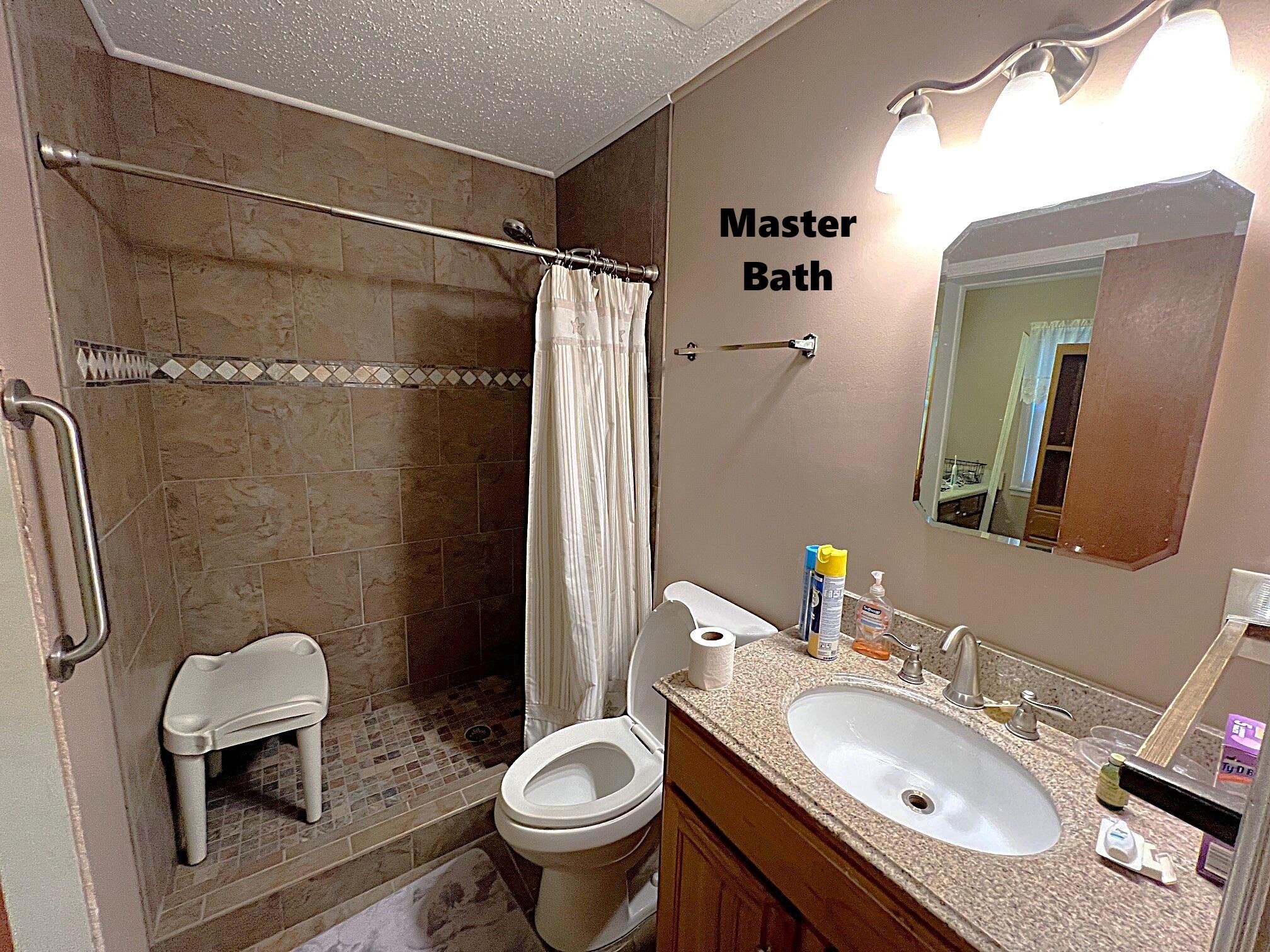 2374 Co Highway 280A DeFuniak Springs, FL 32435 - Photo 31 of 66 a bathroom with a sink toilet and shower