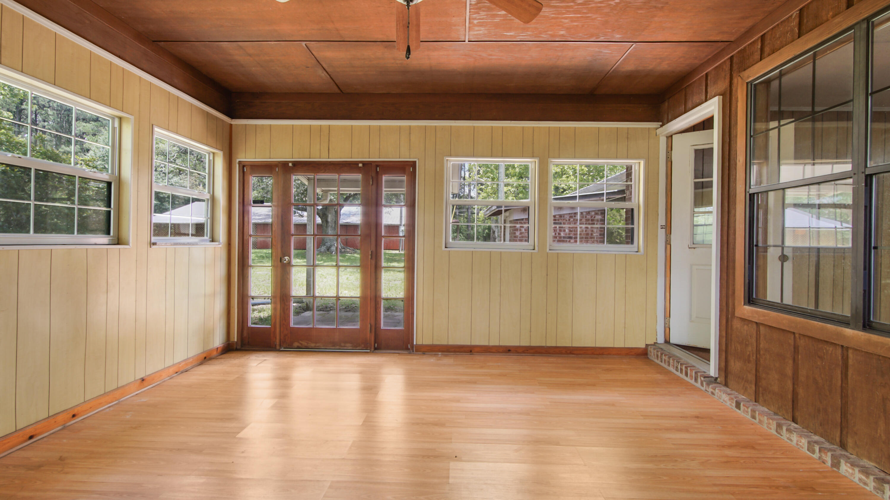 2374 Co Highway 280A DeFuniak Springs, FL 32435 - Photo 42 of 66 an empty room with wooden floor and windows