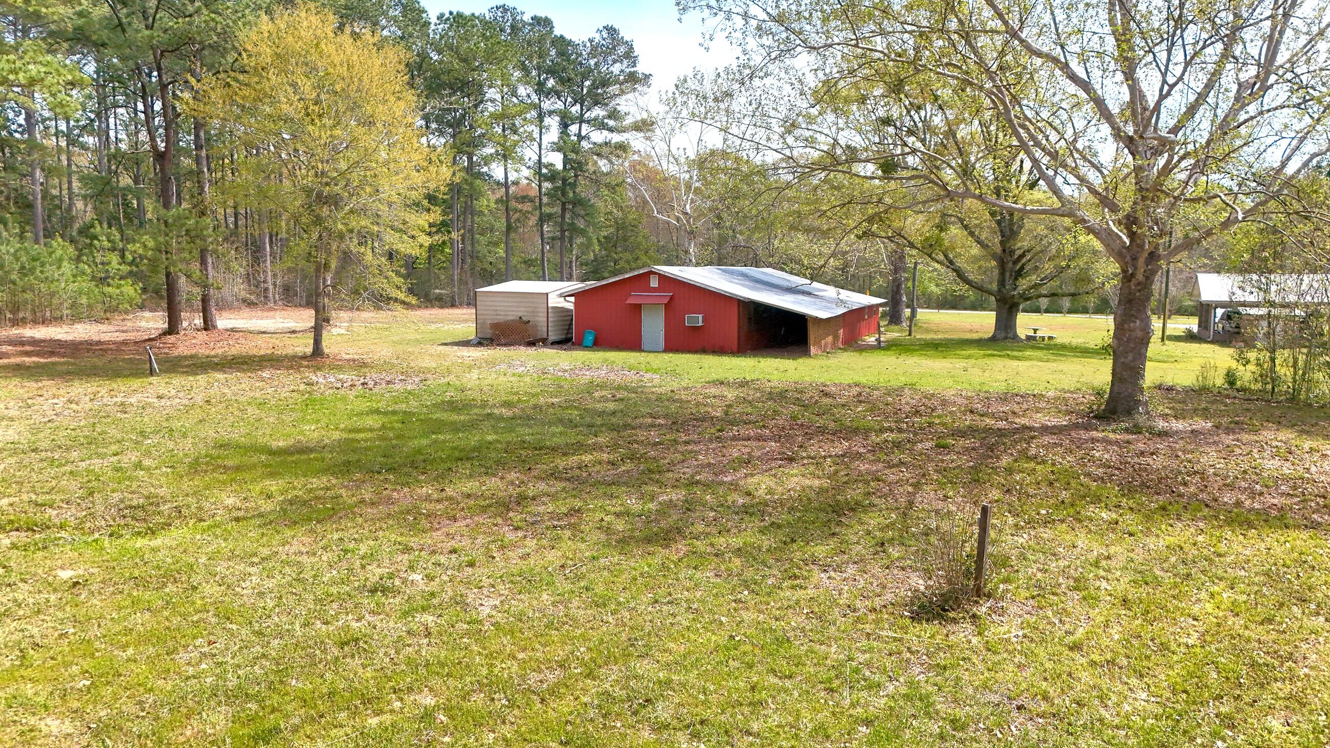 2374 Co Highway 280A DeFuniak Springs, FL 32435 - Photo 45 of 66 a backyard of a house with swimming pool and large trees