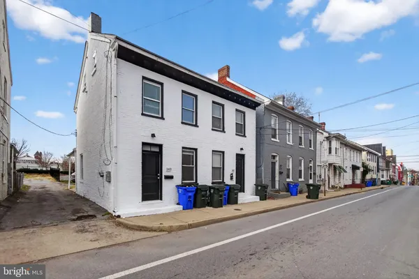 a front view of a building with street view