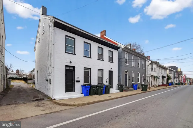 a front view of a building with street view