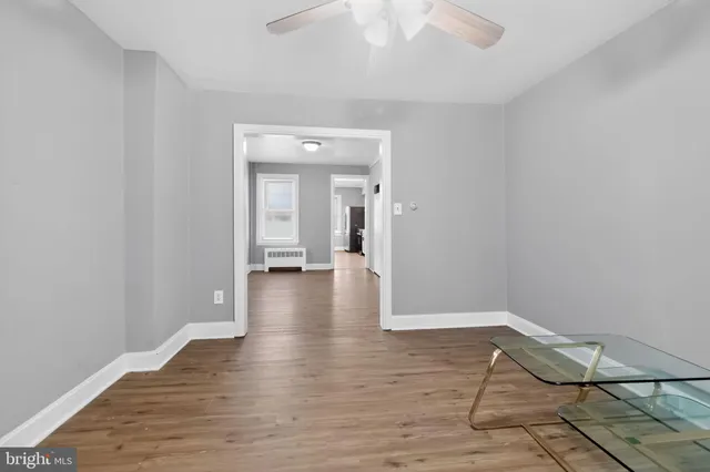 a view of a livingroom with wooden floor