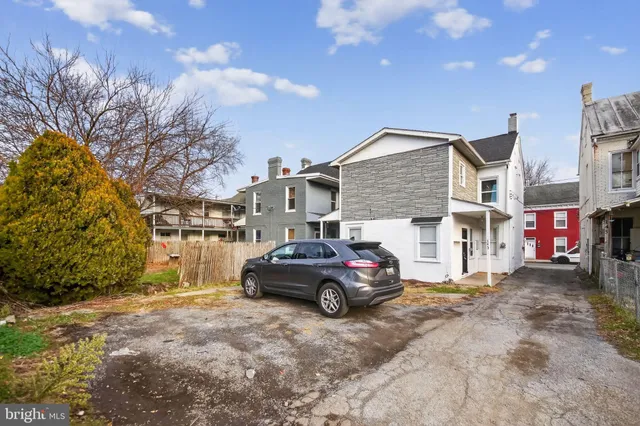 a car parked in front of a house