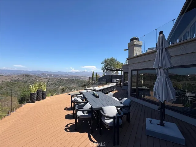 a terrace of a house with outdoor seating