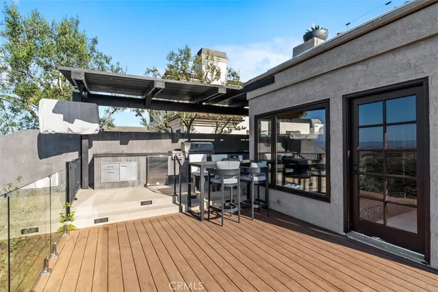 a view of a chairs and table in a patio