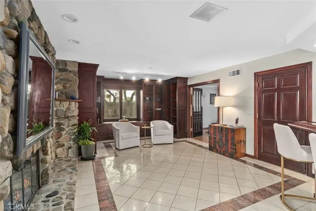 a lobby with furniture and floor to ceiling window