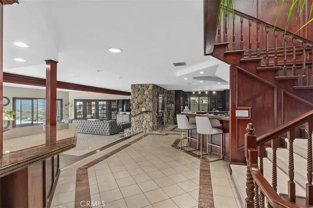 a view of a patio with wooden floor and iron stairs