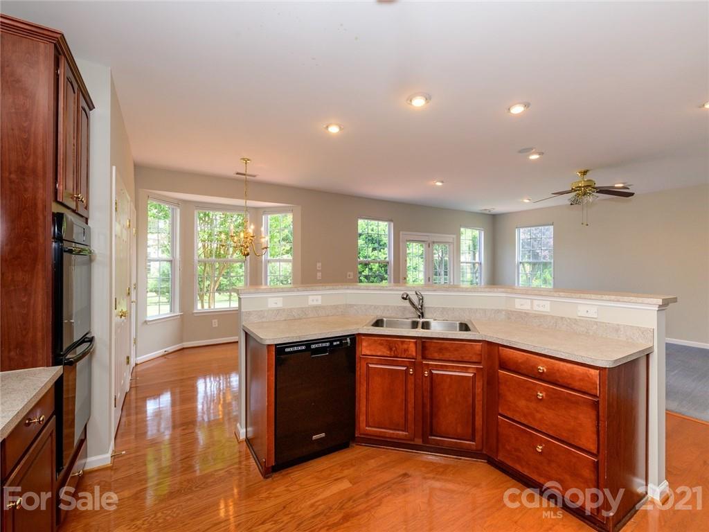 955 Platinum Drive Fort Mill, SC 29708 - Photo 14 of 37 a kitchen with lots of counter top space and wooden floor
