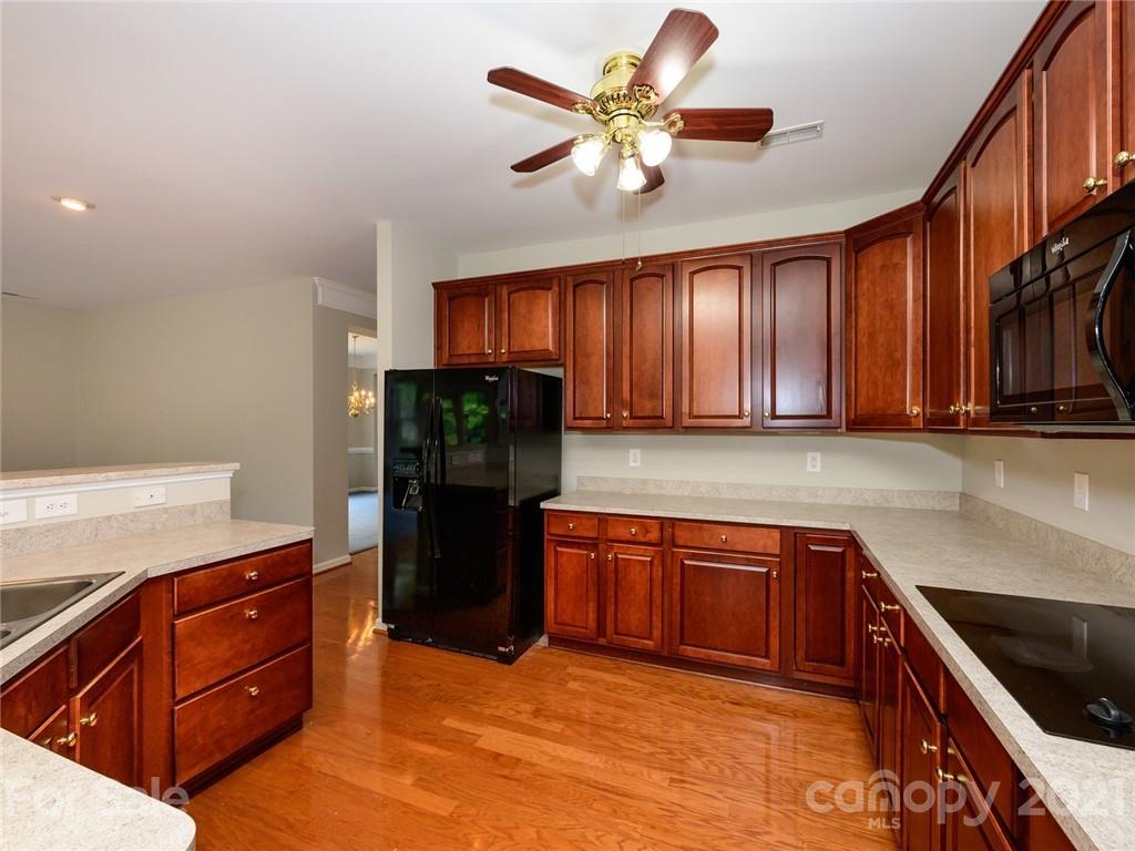 955 Platinum Drive Fort Mill, SC 29708 - Photo 15 of 37 a kitchen with stainless steel appliances granite countertop a refrigerator and a sink