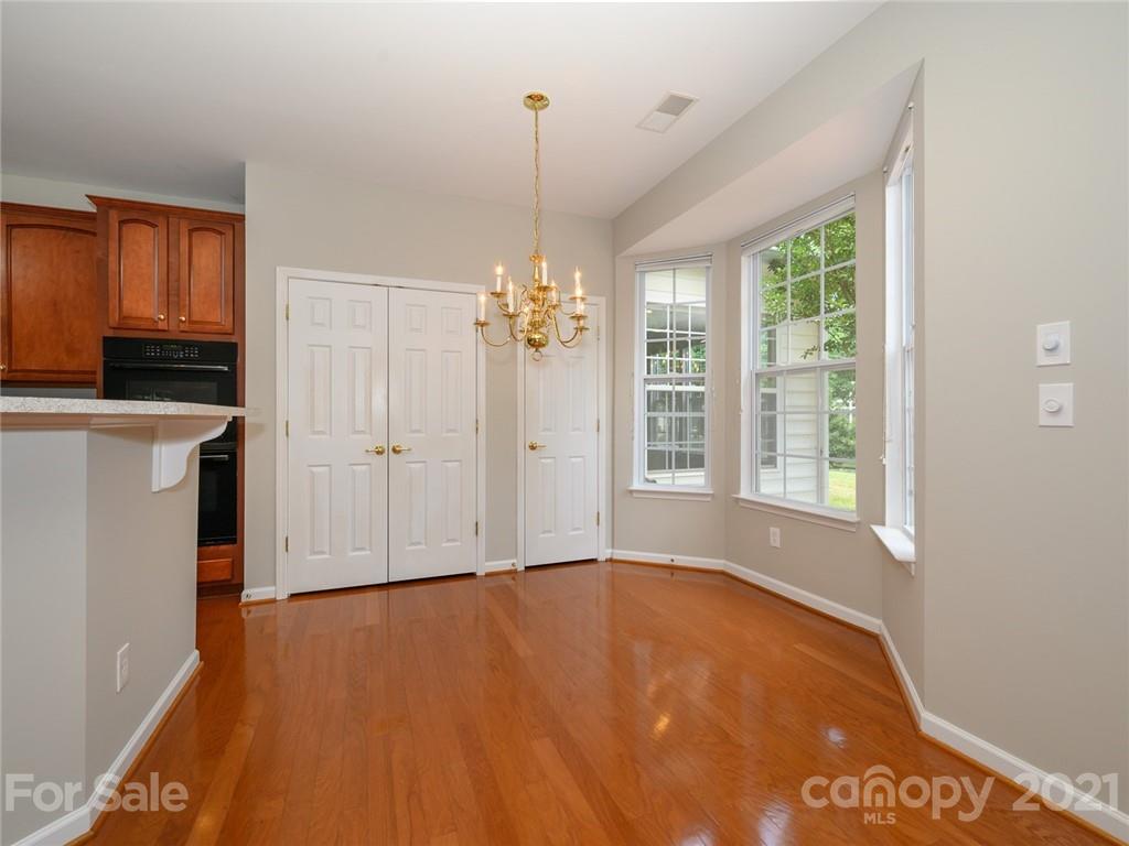 955 Platinum Drive Fort Mill, SC 29708 - Photo 16 of 37 a view of an empty room with a window and chandelier fan