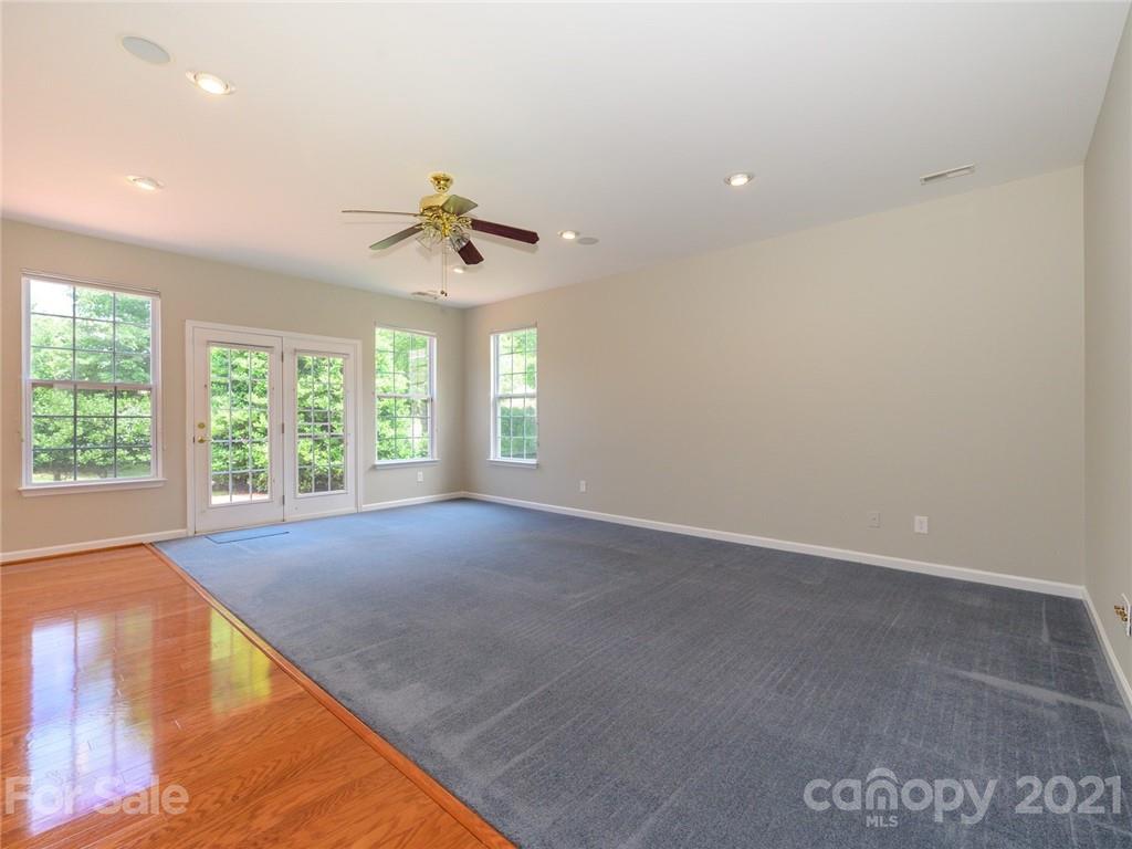955 Platinum Drive Fort Mill, SC 29708 - Photo 19 of 37 an empty room with windows and ceiling fan