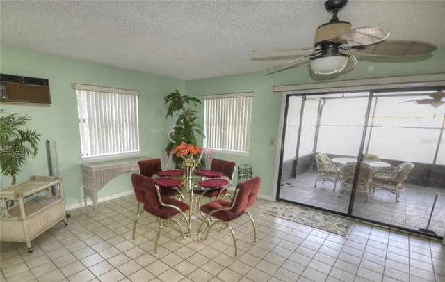 a dining room with furniture and window