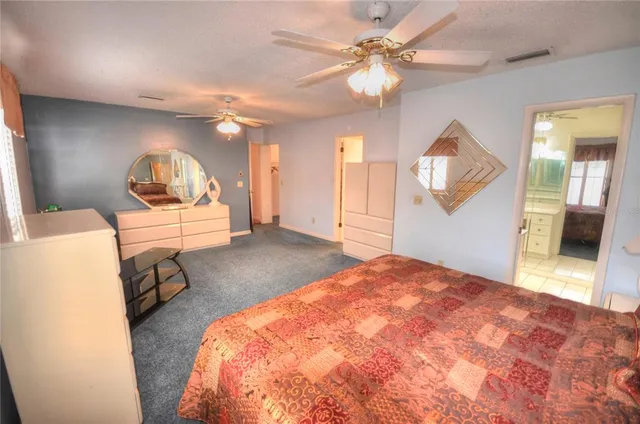 a bedroom with a bed and a mirror