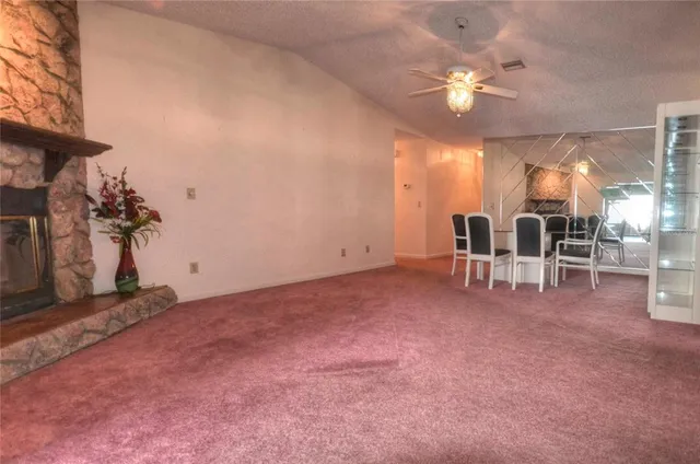 a view of a livingroom with furniture and chandelier