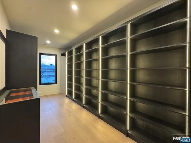 a bathroom with a sink mirror toilet and shower