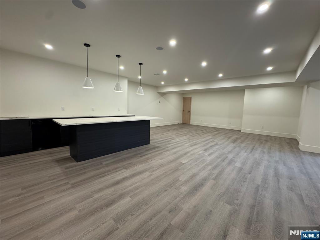 2 Maple Street Englewood Cliffs, NJ 07632 - Photo 34 of 44 a view of an empty room with wooden floor and a sink