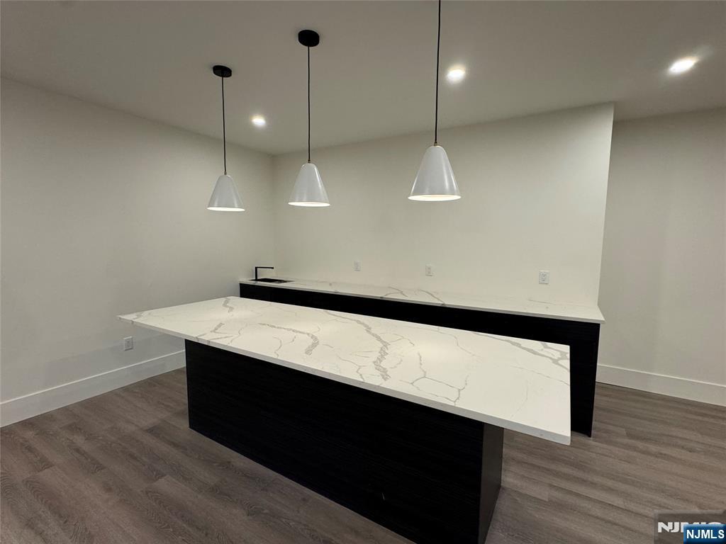 2 Maple Street Englewood Cliffs, NJ 07632 - Photo 35 of 44 a kitchen with a sink a counter space and wooden floor