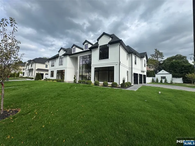 a view of a house with a tub and a yard