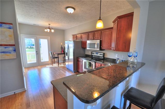 1104 Ransom Way Nashville, TN 37217 - Photo 5 of 12 a kitchen with stainless steel appliances granite countertop a sink refrigerator and microwave