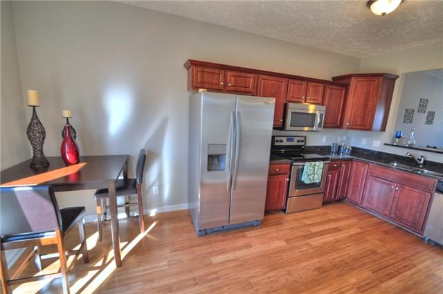 1104 Ransom Way Nashville, TN 37217 - Photo 7 of 12 a kitchen with stainless steel appliances granite countertop a refrigerator a stove top oven a sink and dishwasher