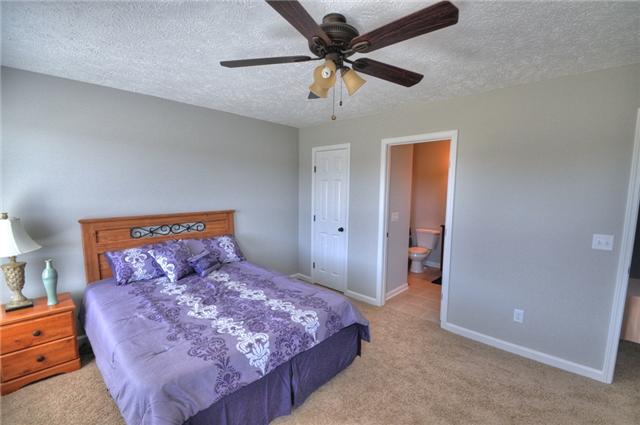 1104 Ransom Way Nashville, TN 37217 - Photo 9 of 12 a bedroom with a large bed and a ceiling fan